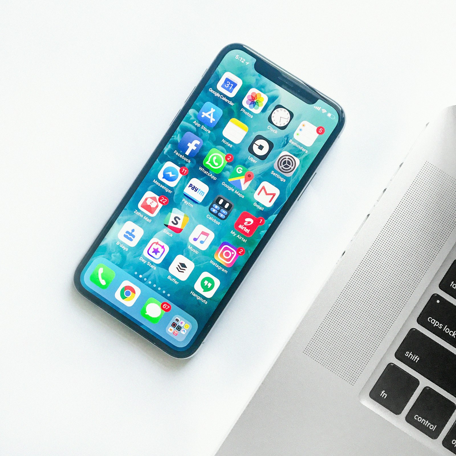 Black iPhone on a desk — Photo by Daniel Korpai on Unsplash